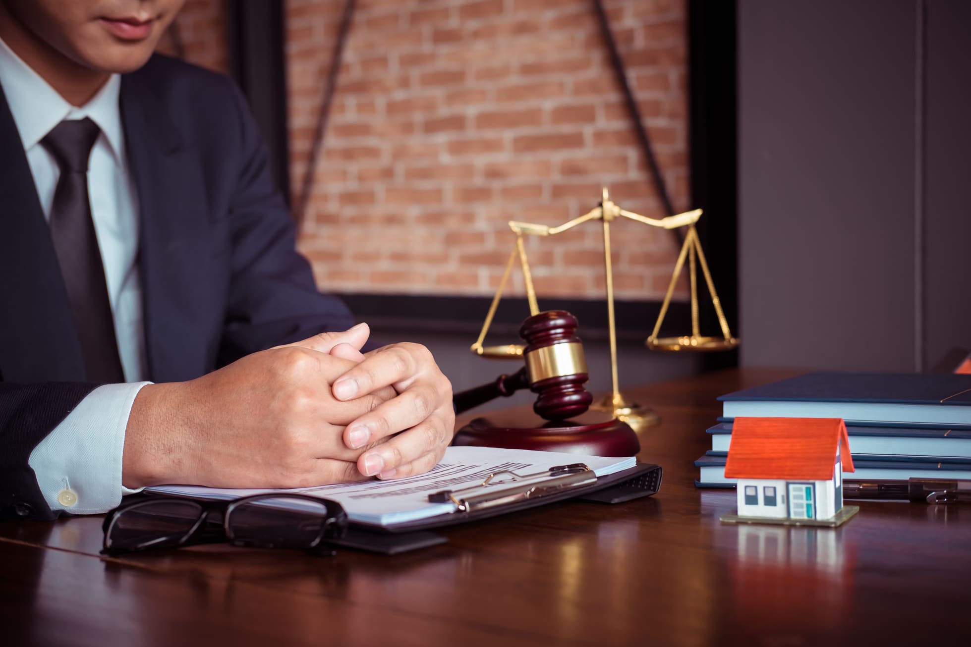 Real Estate Law Concept. Gavel on Sounding Block in Hand's Male